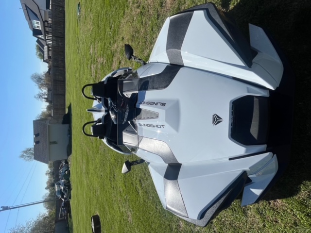 Front view of Slingshot parked on grass.